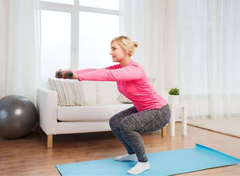 lady doing squats at home