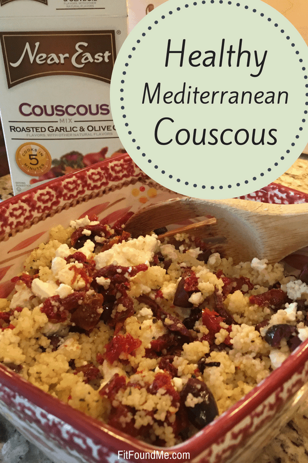 healthy Mediterranean couscous in bowl with feta cheese, olives and near east couscous