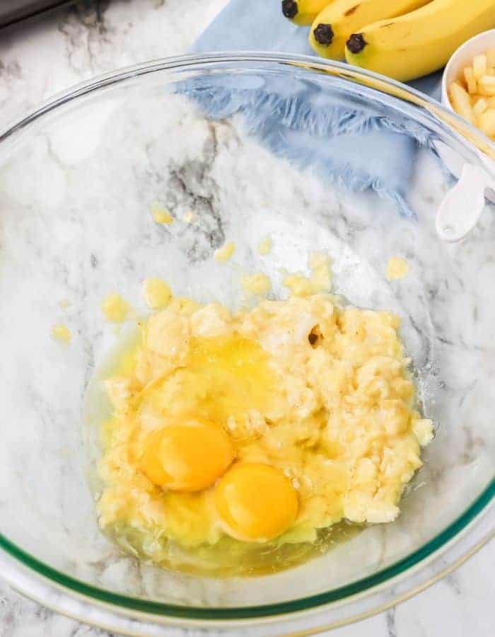 Eggs, banana and butter in a bowl.