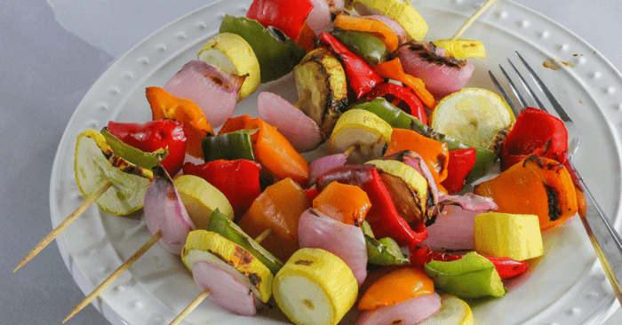 plate of grilled vegetable kabobs ready to eat