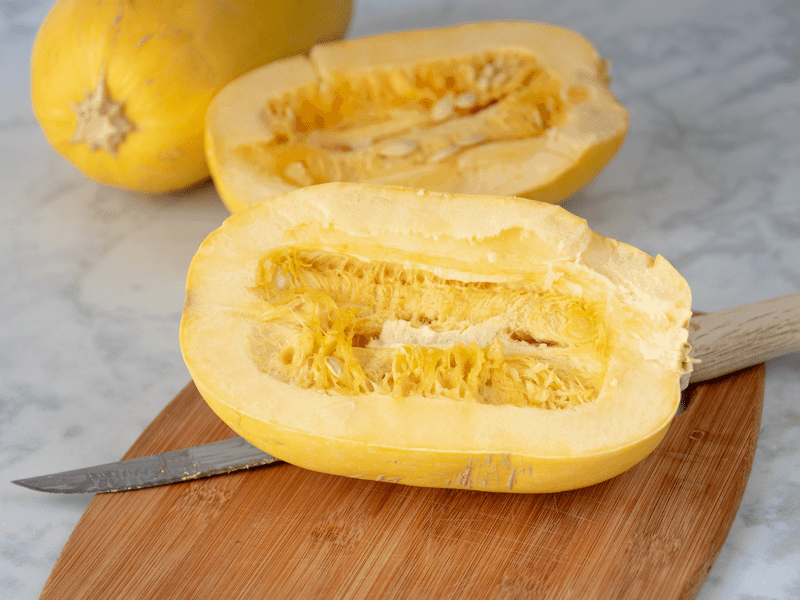 spaghetti squash cut in half lengthways for cooking