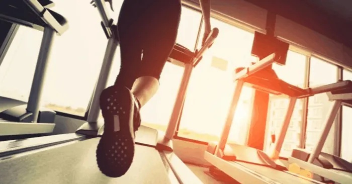 woman running on treadmill