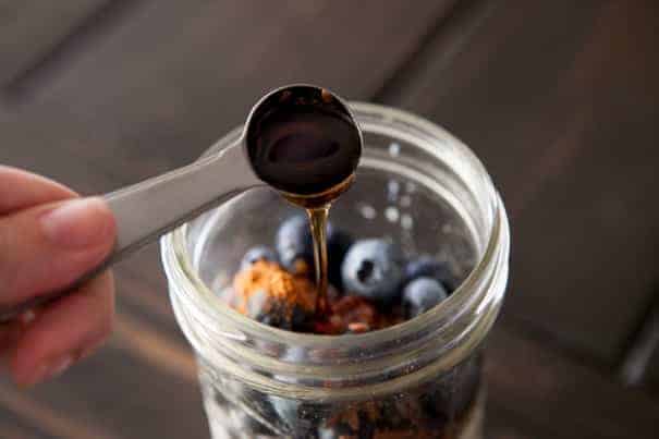 blueberries in jar with overnight oats