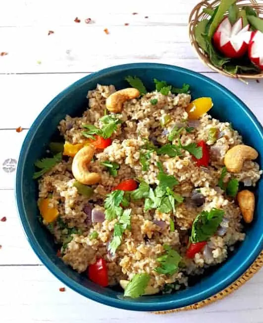 chia oats bowl with green garnish and cashews