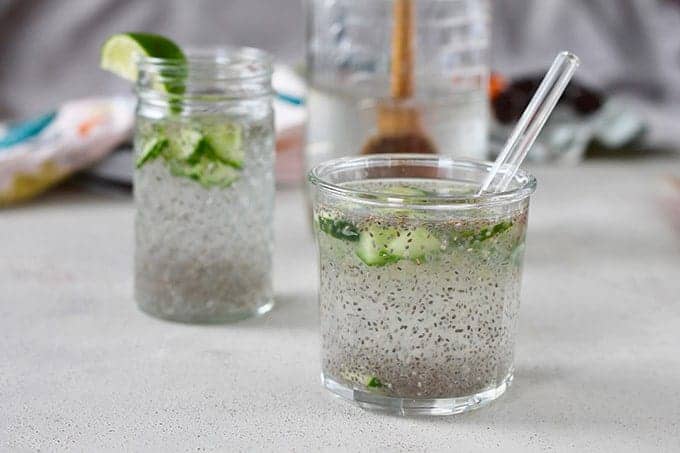 chia drink with lime in a glass with straw