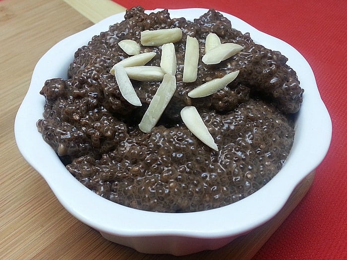 chocolate almond chia pudding in a bowl with almond slivers on top