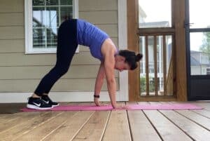 woman doing crawling plank