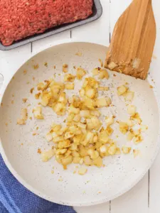 onions lightly browned in a white pan