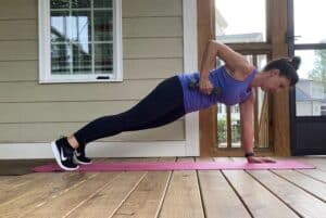 woman doing plank with a row