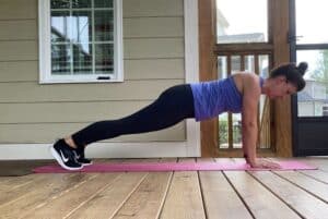 woman doing walking plank