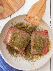 ground beef in pan with sauteed onions and seasonings