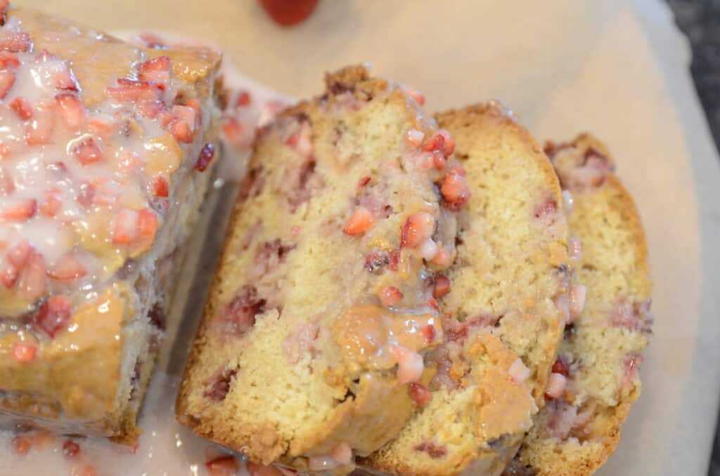 strawberry bread sliced on cooling rack