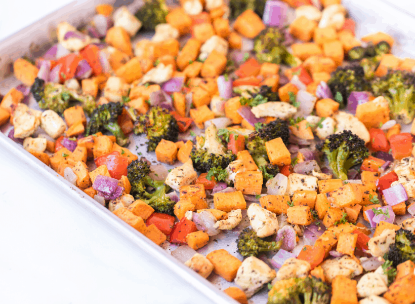 sheet pan with chopped roasted veggies and chicken