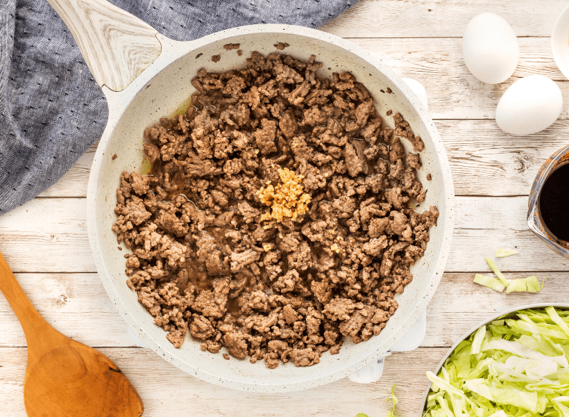 ground beef cooking in pan