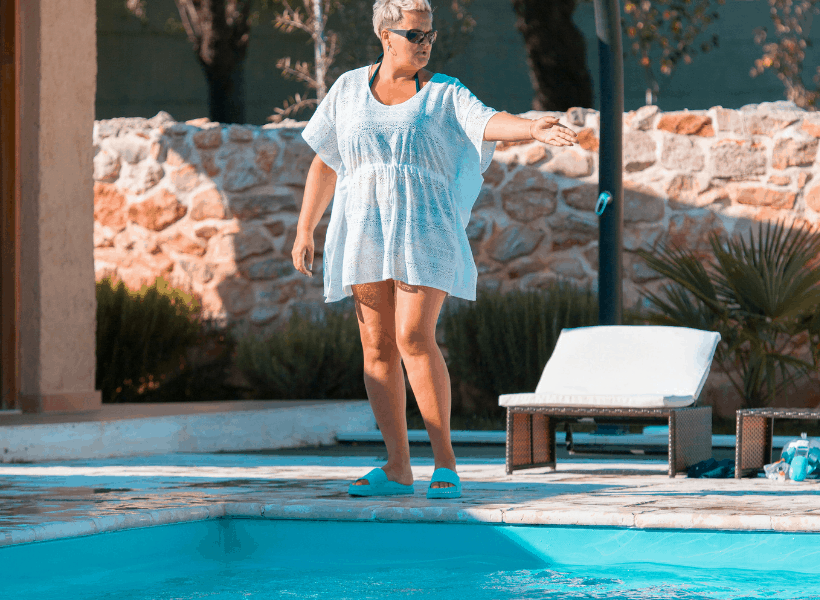 woman standing by pool