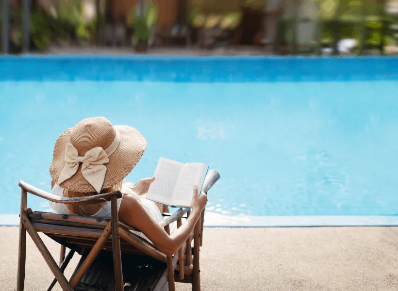 lady sitting by the pool