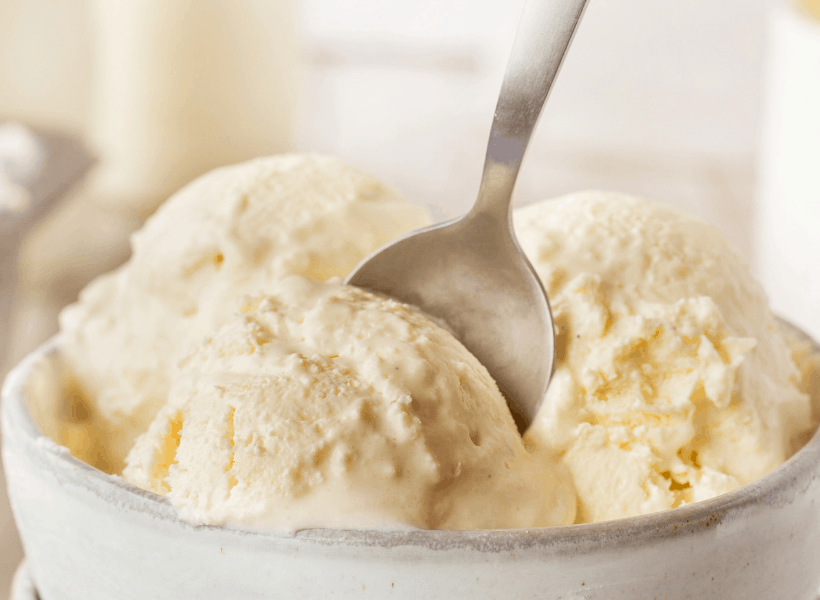 bowl of vanilla ice cream with spoon