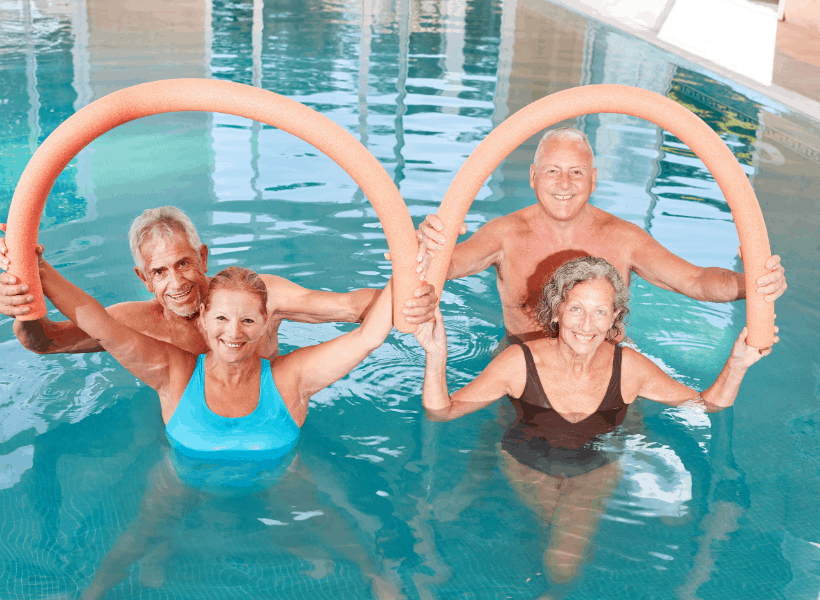 women strengthening swimming muscles in pool