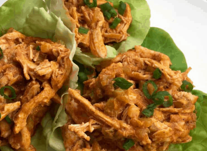 buffalo chicken in lettuce cups on a white plate