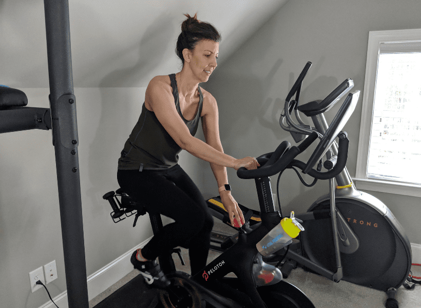 woman on peloton bike doing cardio workout