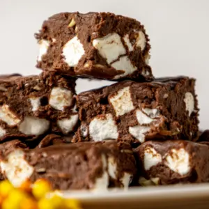 stack of chocolate fudge with marshmallows on a plate