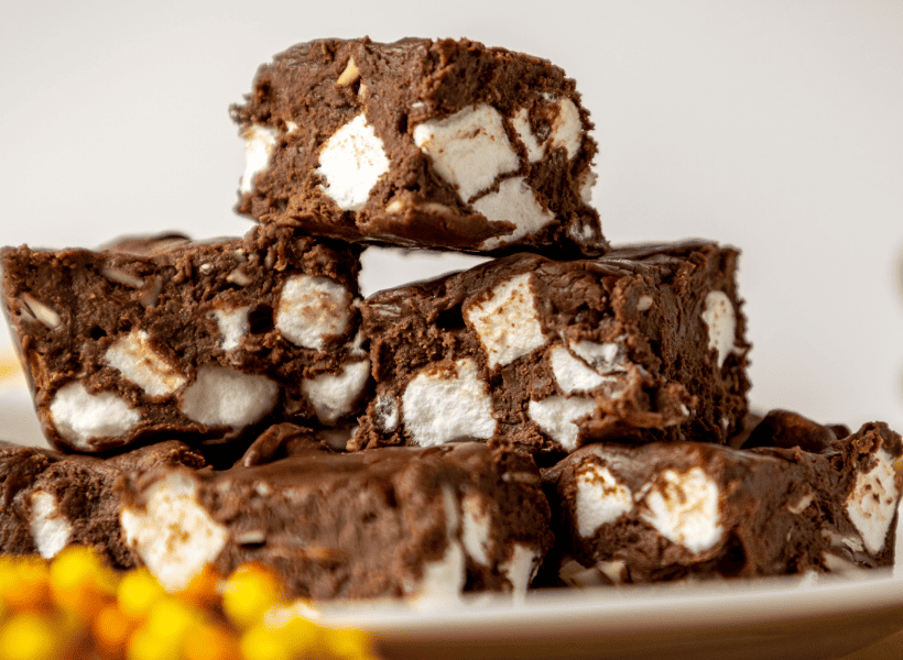 stack of chocolate fudge with marshmallows on a plate