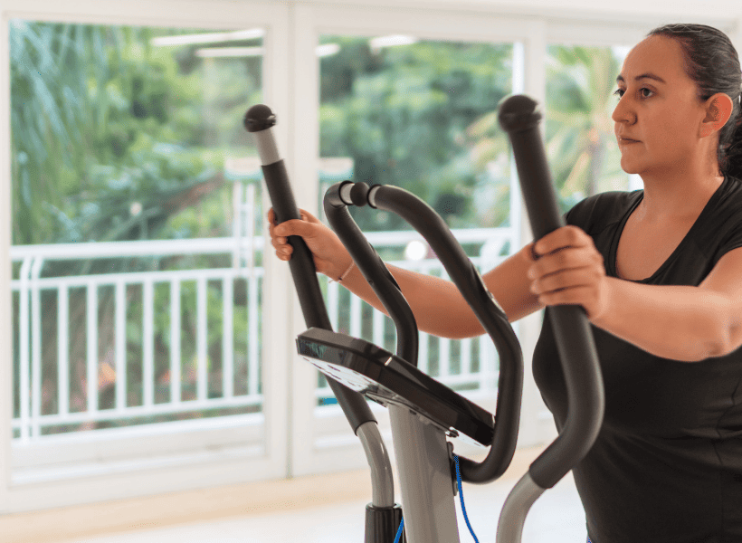 woman on elliptical at home