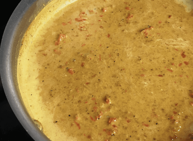 curry sauce simmering in skillet