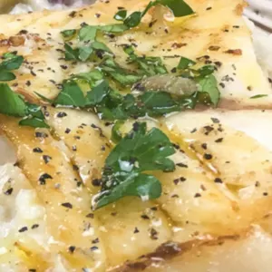 pan seared grouper with garnishment and pepper