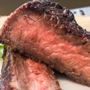 sirloin steak cut in half cooked medium rare
