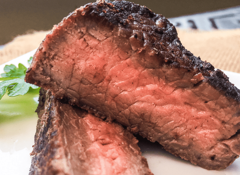 sirloin steak cut in half cooked medium rare