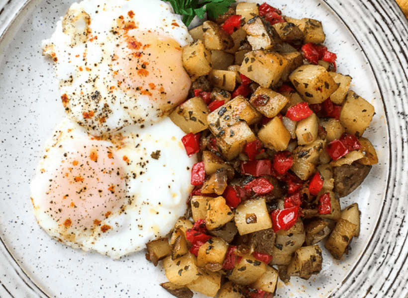 plate of breakfast potatoes and eggs 