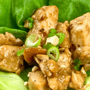 chicken lettuce wraps with peanut sauce on butter lettuce