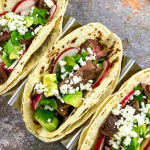 3 steak street tacos loaded in taco holder