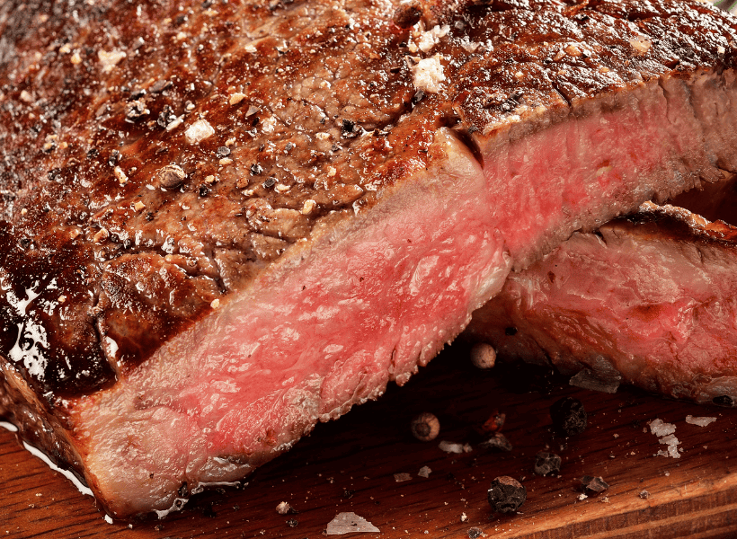 flank steak cooked medium rare sliced in half