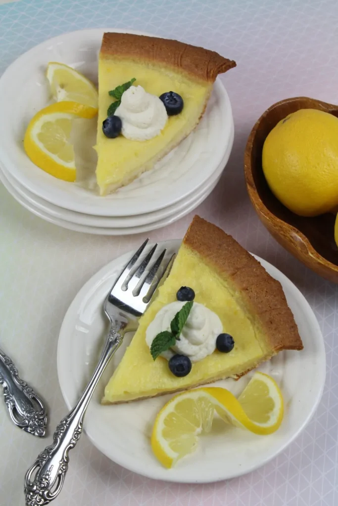 low carb lemon pie on a plate with sliced lemon