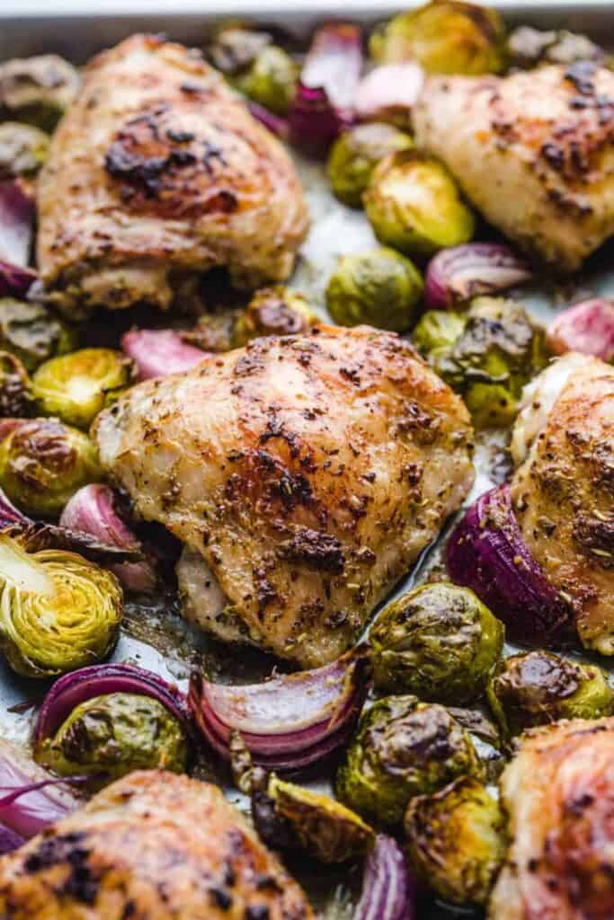 sheet pan chicken thighs with red onions and brussels sprouts