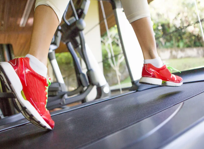 women running on treadmill
