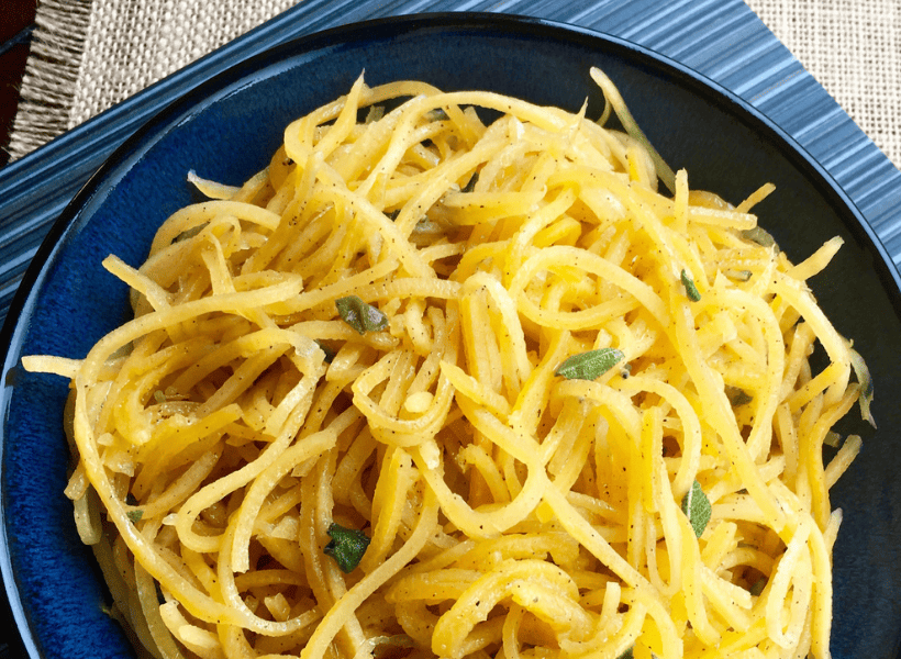 close up of butternut squash noodles with sage and parsley