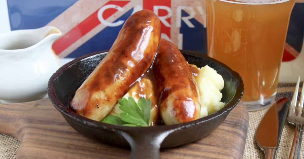 cast iron skillet with bangers and mash