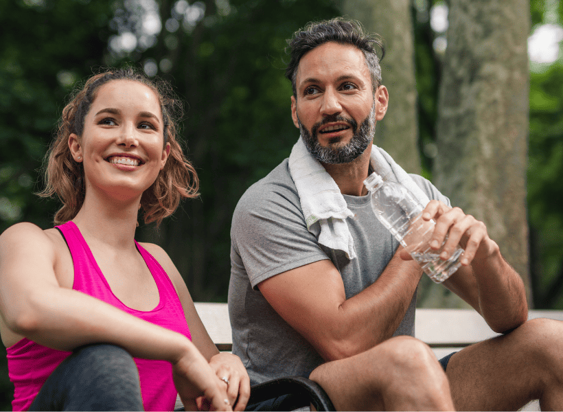 couple sitting outside after exercising