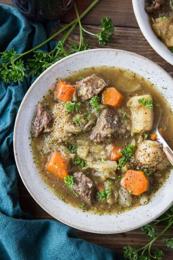 paleo irish beef stew in a white soup bowl