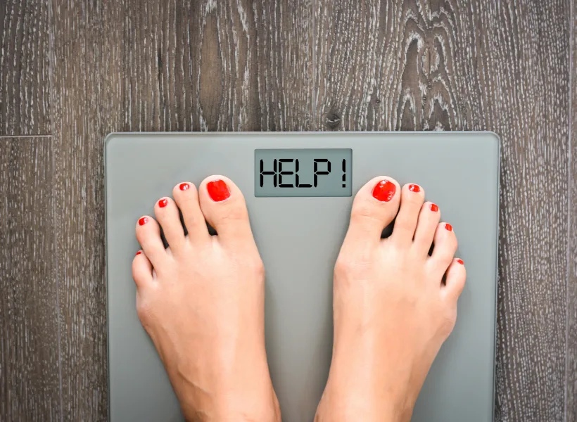 woman's feet on scale