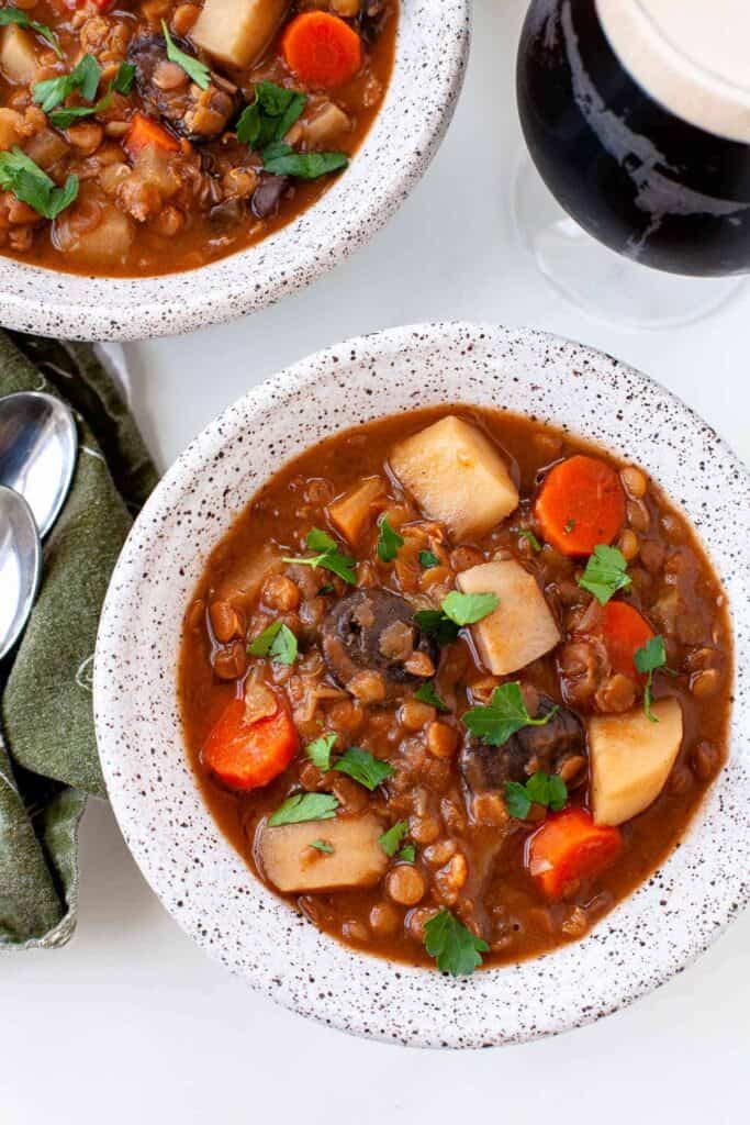 vegetarian irish stew with lentils in a white bowl
