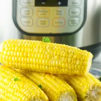4 ears of corn ready to eat placed in front of instant pot
