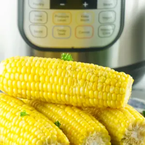 4 ears of corn ready to eat placed in front of instant pot