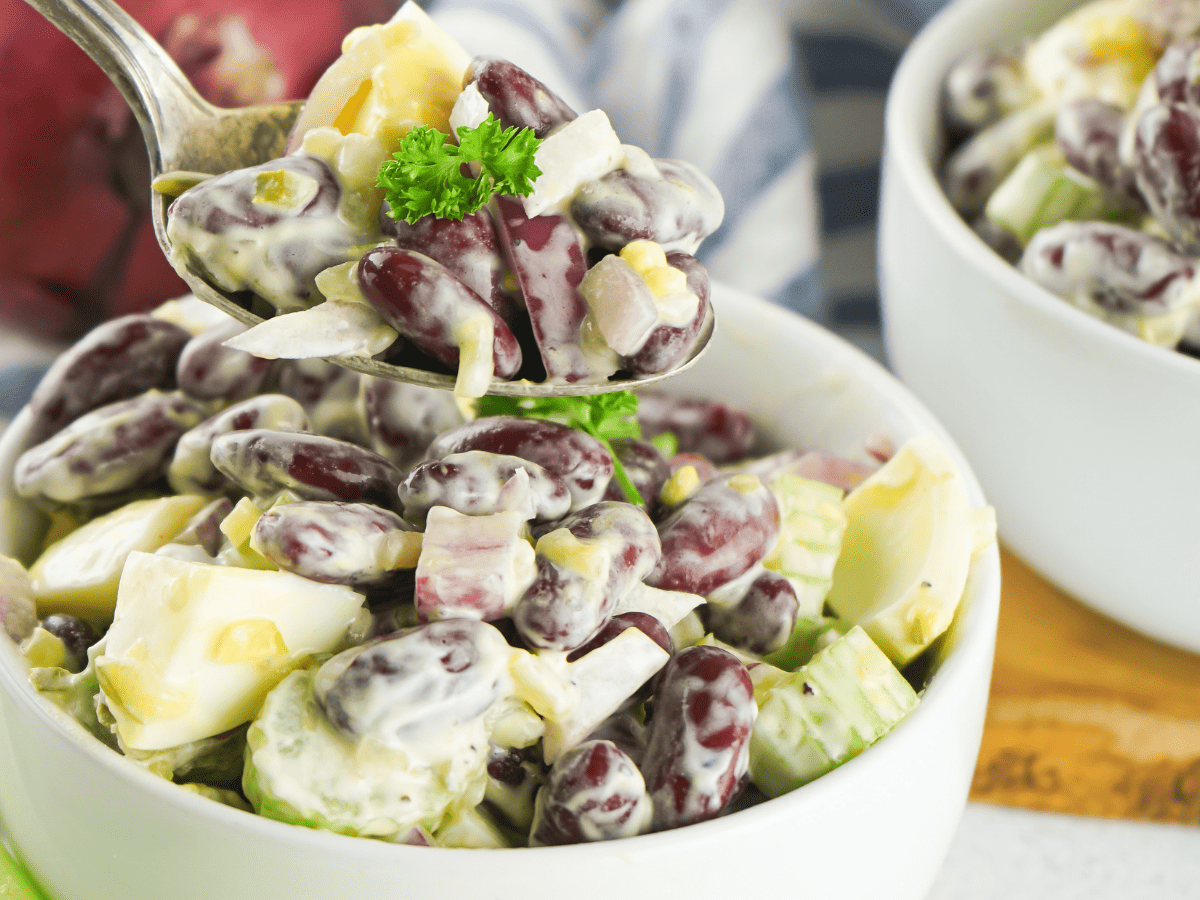 bowls of kidney bean salad with fork