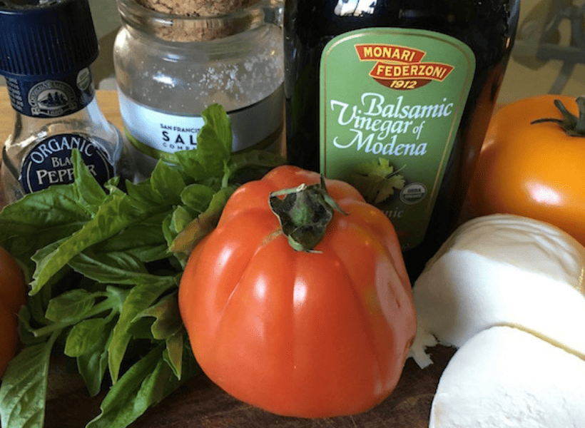 ingredients for keto caprese salad tomatoes, basil, mozzarella, balsamic glaze