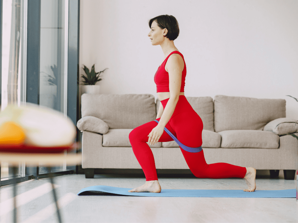 woman in home exercising on yoga mat