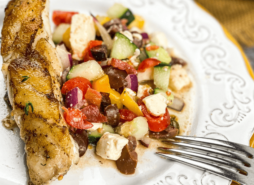 plate of mahi mahi with fresh salad